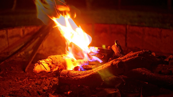 bonfire viewed directly from above with flames and stones which forms a circle