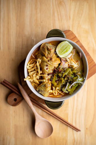 Khao soi - Traditional Thai Food, Thai curry with A noodle dish in a yellow curry with chicken. Khao soy a famous northern Thai food