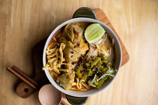 Khao soi - Traditional Thai Food, Thai curry with A noodle dish in a yellow curry with chicken. Khao soy a famous northern Thai food