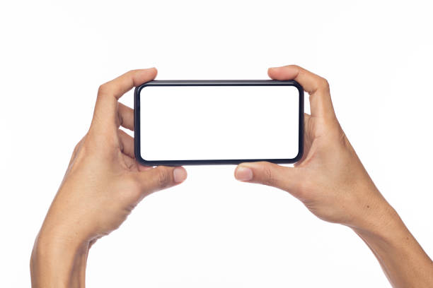 istock Hand business man holding mobile smartphone with blank screen with space for inserting advertising text. isolated on white background with clipping path 1415287585