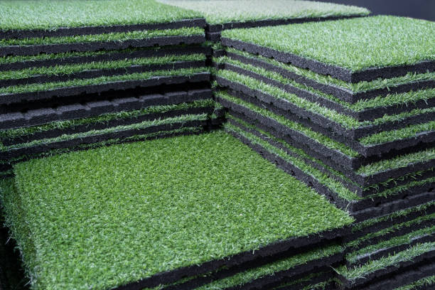 istock Green artificial grass carpet mat with underlay layer asphalt. Lawn turf Grass decoration. Gardening material, Landscape design. 1415289026