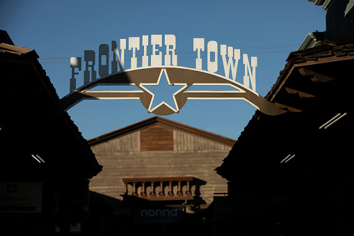 Scottsdale, Arizona, USA - January 4, 2022: Late afternoon light shines on the historic facades of Frontier Town in Old Town Scottsdale.