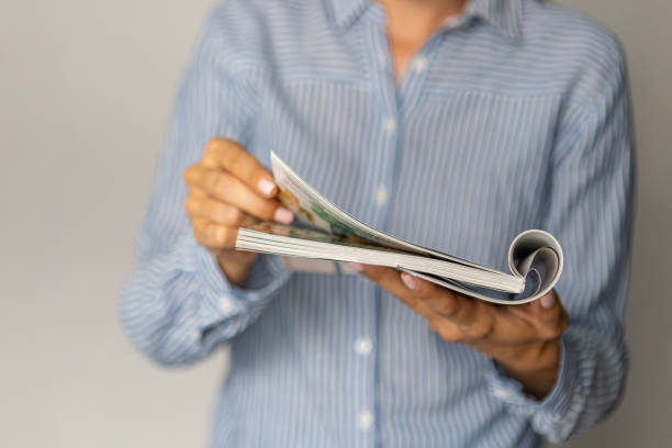 female hands holding mock up magazine indoors
news knowledge study