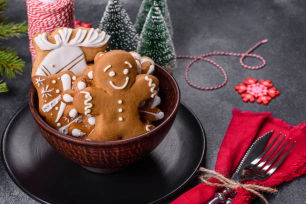 istock Gingerbread, Christmas tree decorations, dried citrus fruits on a gray concrete background 1415303063