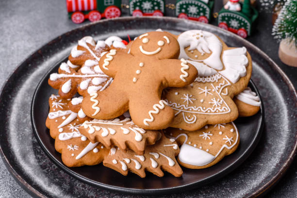 istock Gingerbread, Christmas tree decorations, dried citrus fruits on a gray concrete background 1415303610
