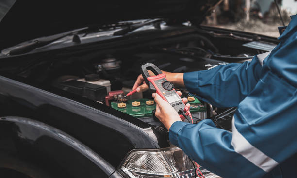 istock Technician checking the electrical system of the car 1415307757