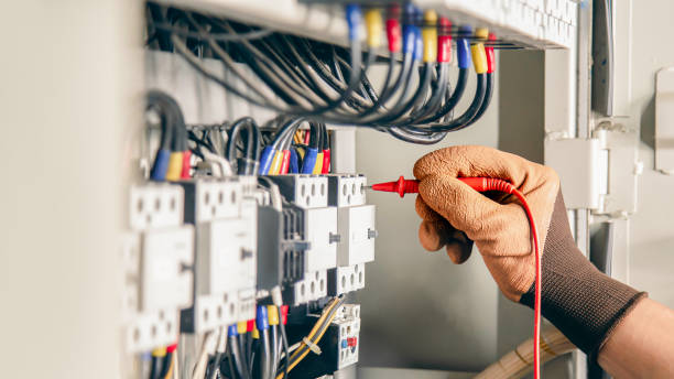 istock Electrical engineer checking the operation of electrical control cabinet, maintenance concept. 1415308361
