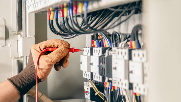 istock Electrical engineer checking the operation of electrical control cabinet, maintenance concept. 1415308369