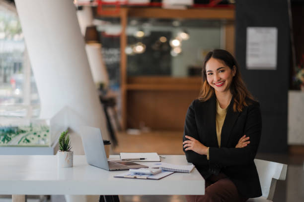 istock Asian businesswoman or accountant using laptop while analyzing financial data with weekly schedule in the modern office 1415309036