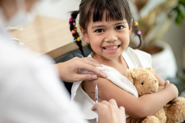 istock Successful covid-19 vaccination. cute little girl while being immunized against coronavirus 1415309524