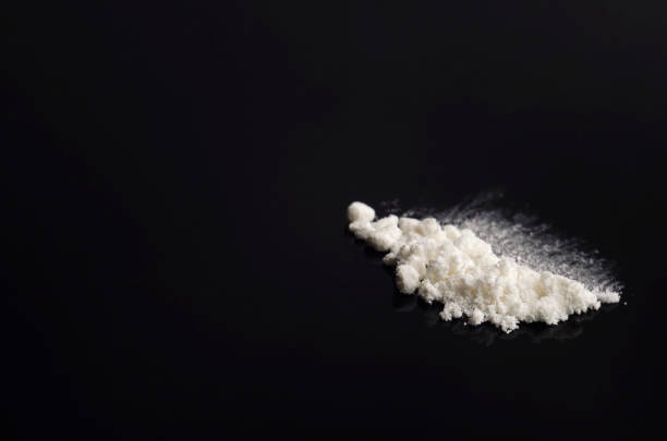 istock White drug on a black background 1415310776