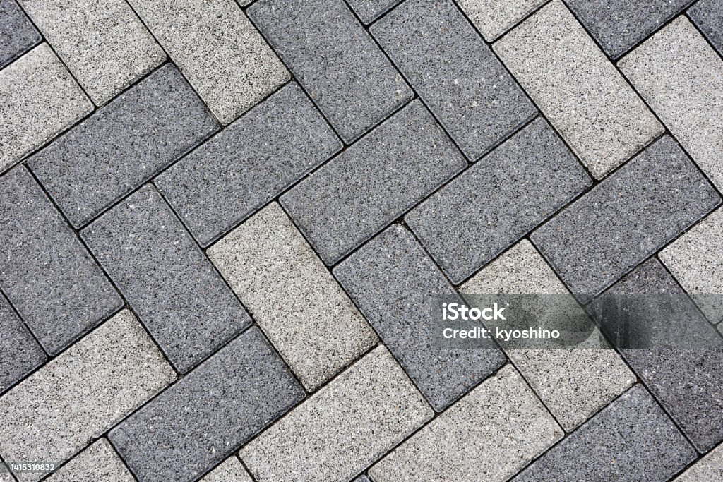Pavement texture backgrounds High angle view of pavement texture. Paving Stone Stock Photo