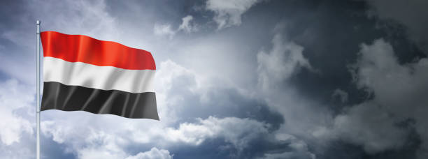 istock Yemen flag on a cloudy sky 1415313293