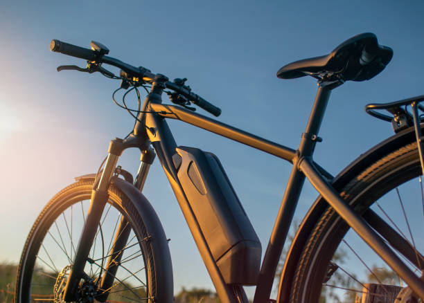 e-bike battery in the heat of the sun - electric bicycle imagens e fotografias de stock