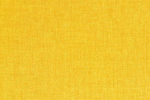 Yellow linen fabric cloth texture background, seamless pattern of natural textile.