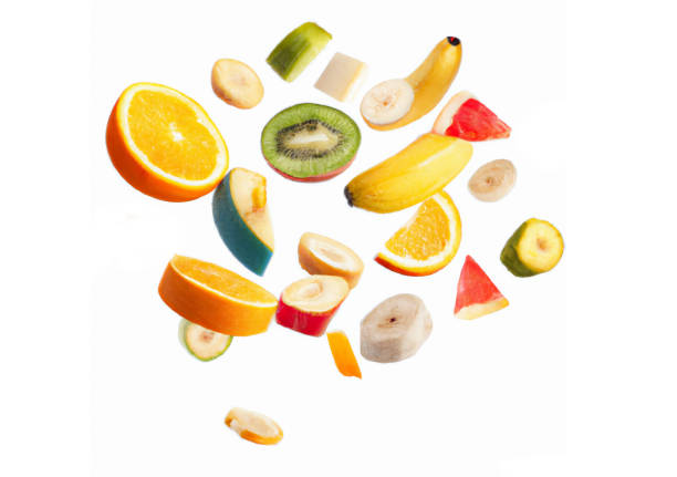 istock pieces of fruit on isolated white background 1415319842