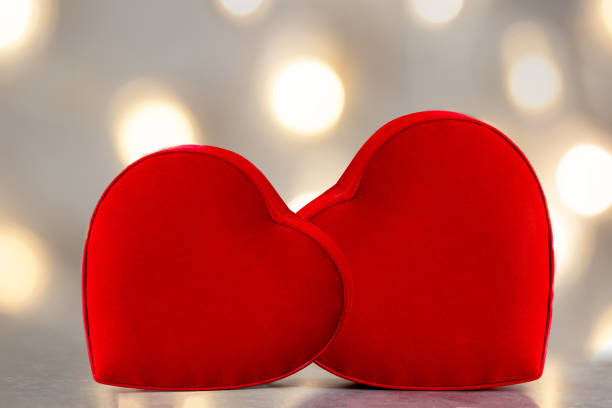istock Couples holding heart shaped gift box with bokeh background. 1415326577