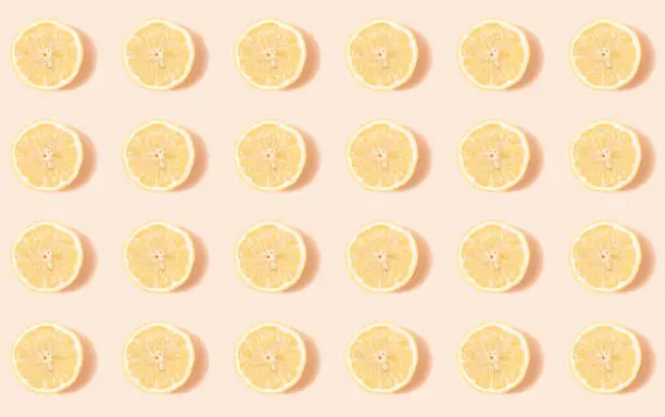 pattern of lemon circles on a pale pink background - summer pattern for design