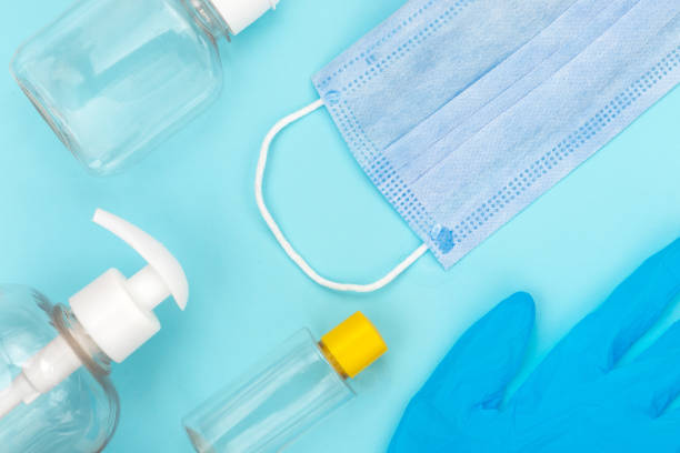 istock Used coronavirus materials lays on blue isolated background. 1415337703