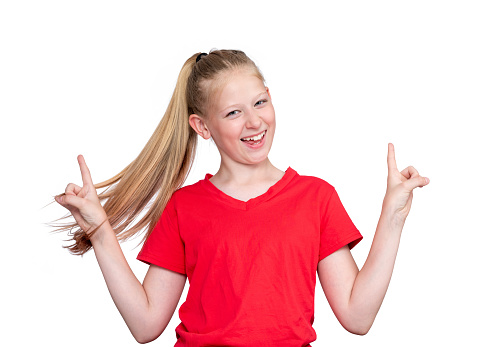 Portrait of a happy smiling girl in a red T-shirt making a sign with her hands, isolated on a white background