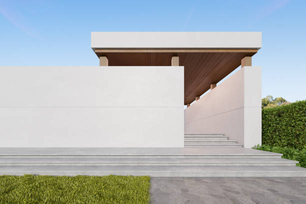 istock 3d rendering of concrete building entrance with large plain wall. 1415347874