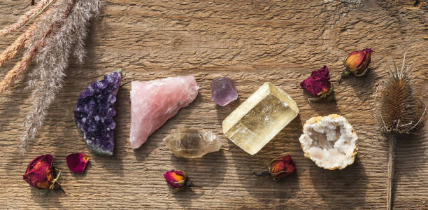 istock Colorful healing crystals and minerals in a row 1415348235