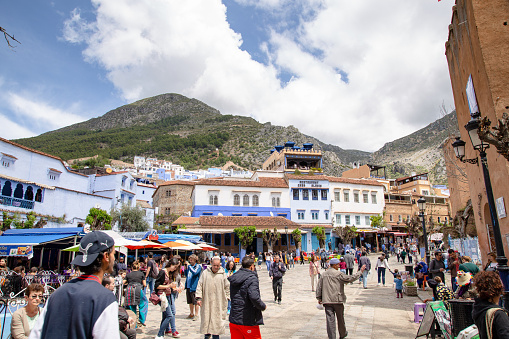 Chefchaouen, Morocco - 20 april 2019 : high angle view of tourists walking in Plaza Uta el-Hammam