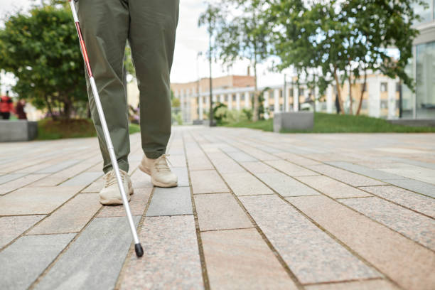 istock Blind Man with Cane Walking in City 1415350026