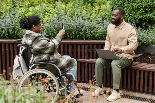 istock Woman with Disability Taking Smartphone Photo 1415350074