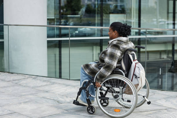 istock Woman with Disability Commuting in City 1415350133