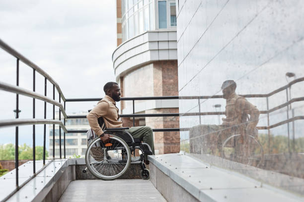 istock Black Man in Wheelchair using Ramp 1415350166