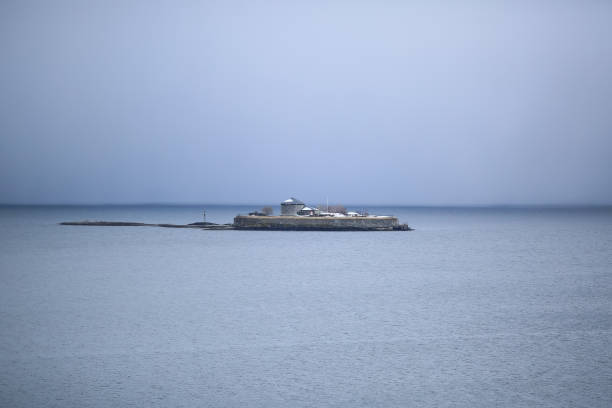 Foggy weather  at Trondheim fjord, view of the island Munkholmen located near the Norwegian city trondheim