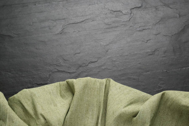 istock Natural burlap fabric on black table, top view. Space for text 1415352958