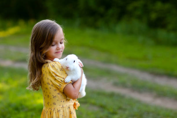 a little girl with rabbit