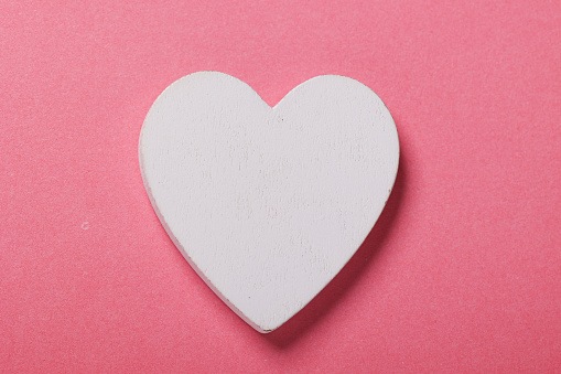 White heart on pink background