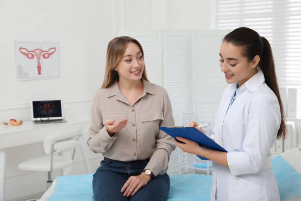 Young woman having appointment with gynecologist in clinic Young woman having appointment with gynecologist in clinic gynaecologist stock pictures, royalty-free photos & images