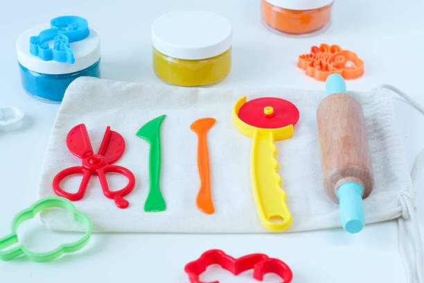 istock Homemade modeling clay tools kit. Colorful plasticine with shapes and cutters. 1415356139