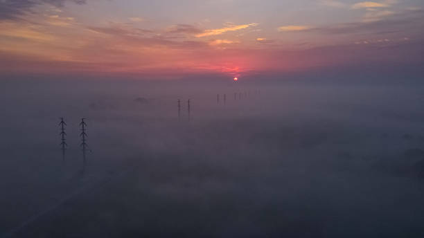 istock Powerline in the fog 1415357732