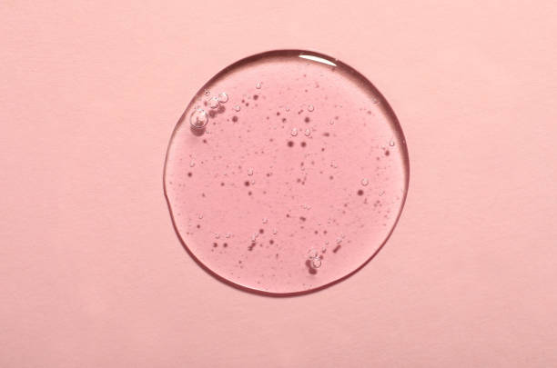 istock Sample of cosmetic gel on pink background, top view 1415358105