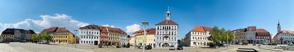 Bischofswerda, Germany - August, 10 - 2022: Market square with town hall in the center and typical houses around.