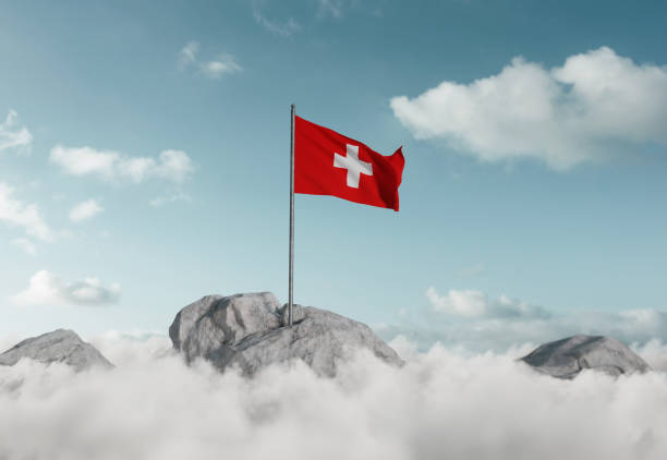 3d renderização de agitação bandeira suíça acima do mar de nuvens para celebrar o feriado nacional de 1 de agosto - swiss culture switzerland european alps rock - fotografias e filmes do acervo