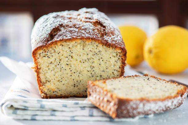 istock Lemon cake with poppy seeds, sliced on a gray background. 1415361836