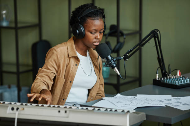 Young Black Woman Recording Music in Studio