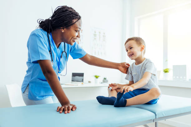 istock Close up of a young boy getting checked up in the doctors office 1415363912