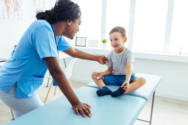 istock Young doctor looking at patient 1415363927