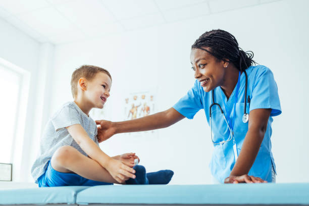 istock Happy African American pediatrician talking with kid 1415363930