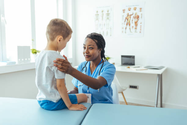 istock Nurse encourages young patient 1415365500