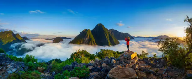 Photo of Panorama of Tourist take a photo at Pha Dang viewpoint in Laos.