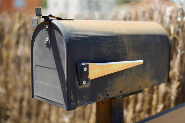 istock An old rusty outdoor postal post office box with grass behind it 1415369138