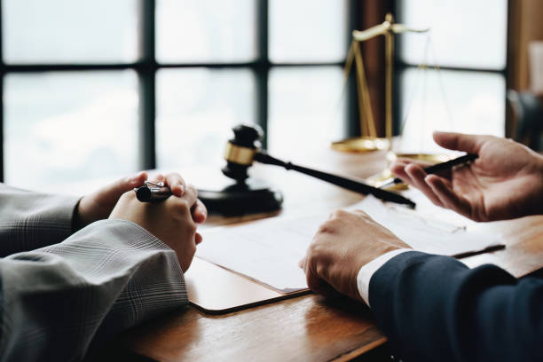 istock Discussing legal matters and signing important documents 1415370260